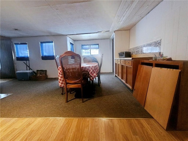 unfurnished dining area with light wood-type flooring