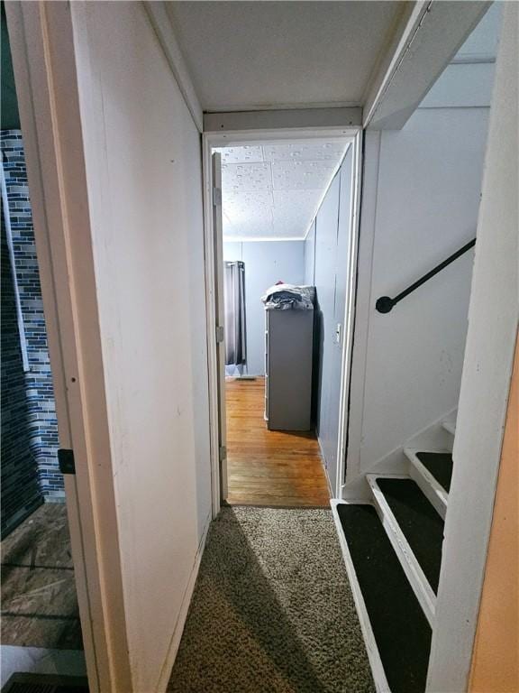 corridor with hardwood / wood-style floors