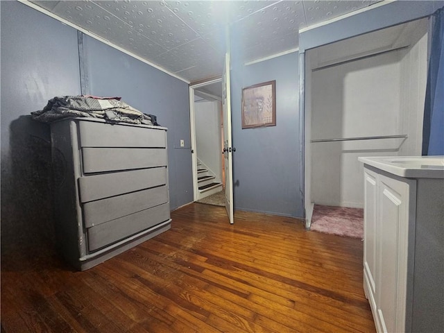 unfurnished bedroom with dark hardwood / wood-style floors