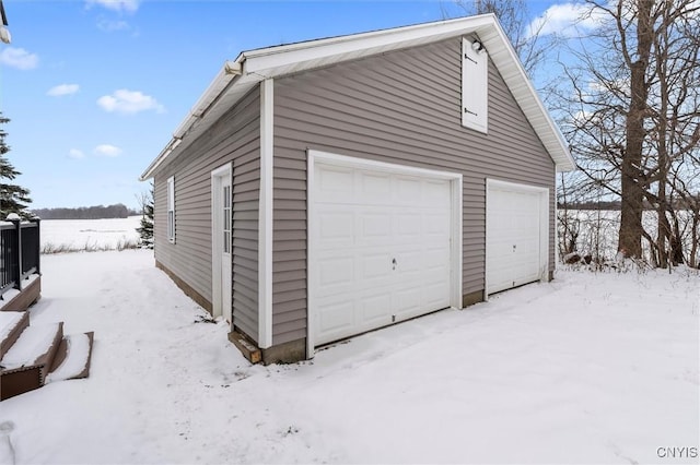 view of snow covered garage