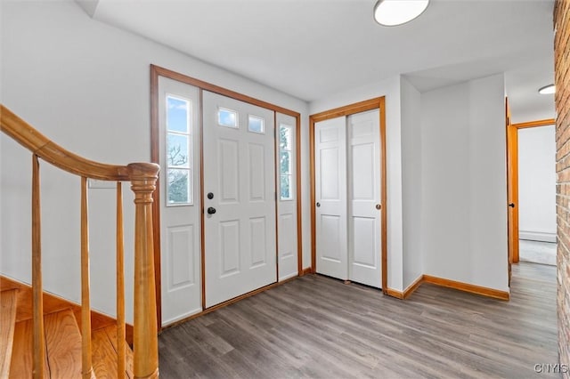 entrance foyer with wood-type flooring and a baseboard radiator