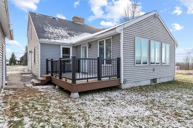 rear view of property featuring a deck