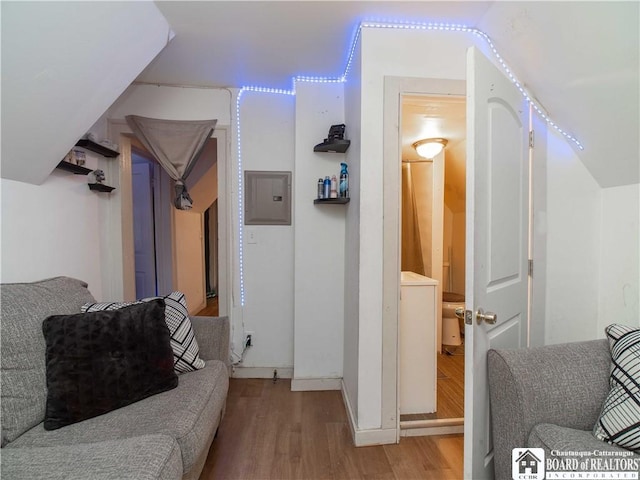 interior space with electric panel and light hardwood / wood-style floors