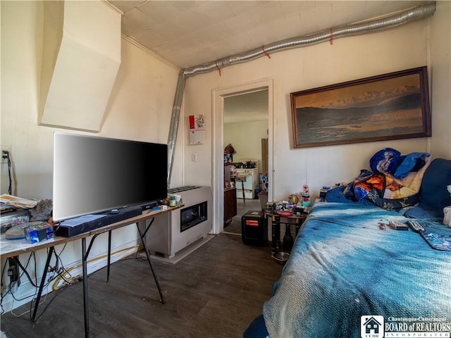 bedroom featuring dark wood-type flooring