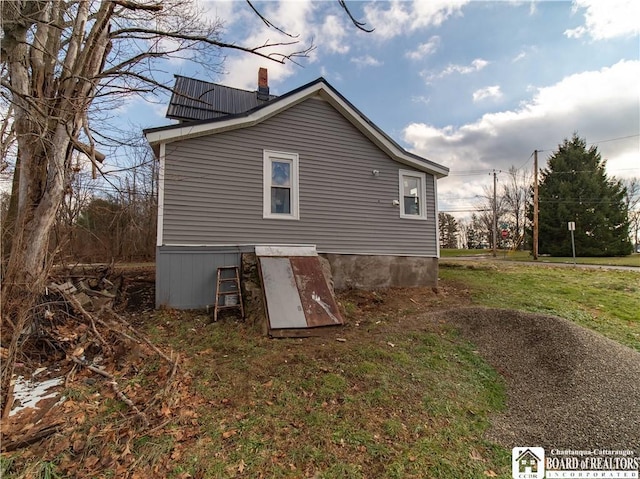 back of house with a yard