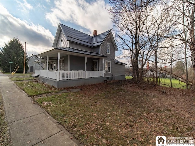 view of property exterior featuring a porch