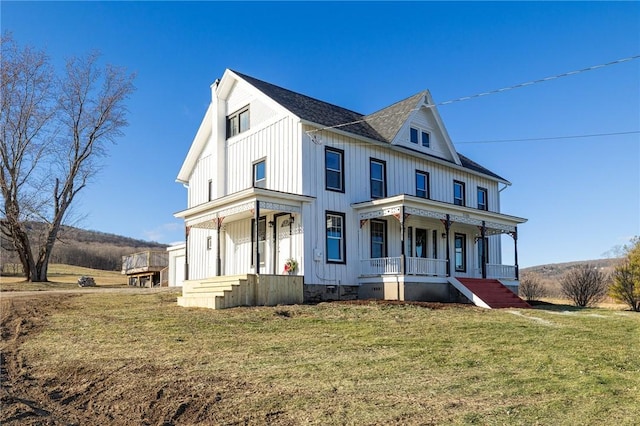 view of front of property with a porch and a front yard