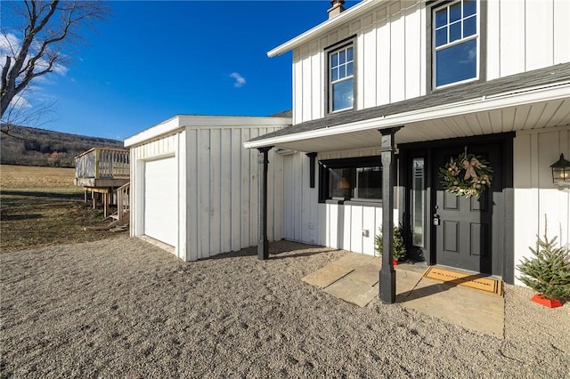 doorway to property featuring a garage