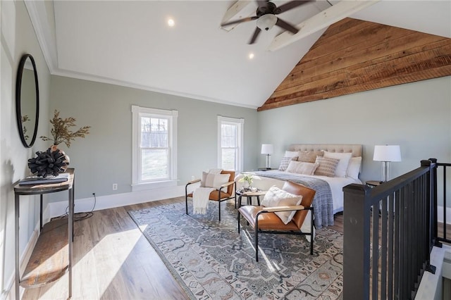 bedroom with ceiling fan, crown molding, high vaulted ceiling, and wood-type flooring