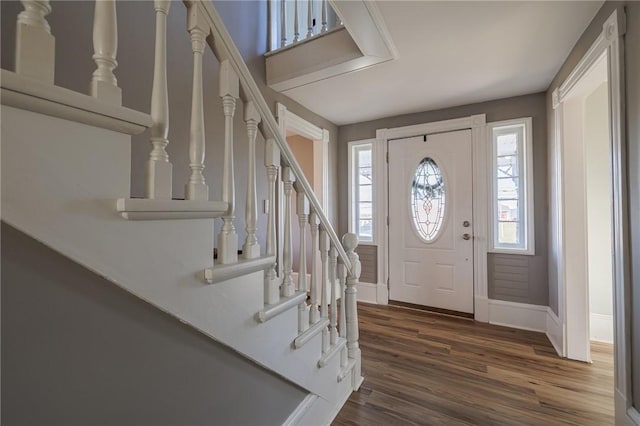 foyer entrance with dark hardwood / wood-style floors