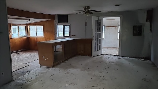 kitchen featuring kitchen peninsula, french doors, electric panel, and ceiling fan