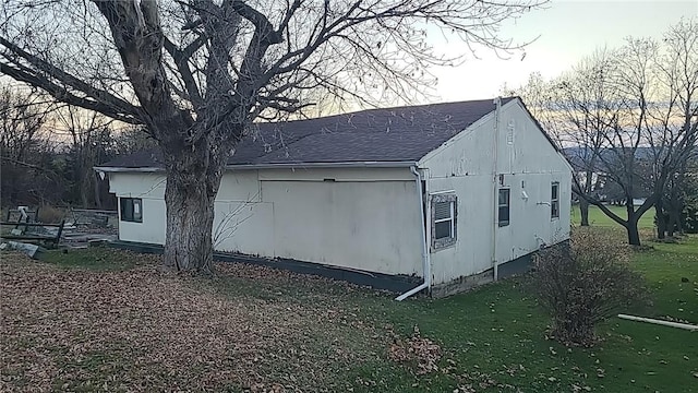 view of home's exterior with a yard