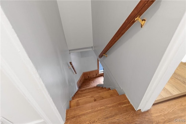 stairs featuring wood-type flooring