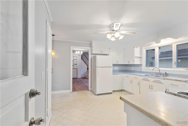 kitchen with white cabinetry, sink, hanging light fixtures, crown molding, and white appliances