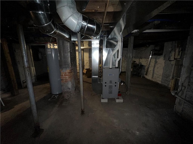 basement featuring heating unit and water heater