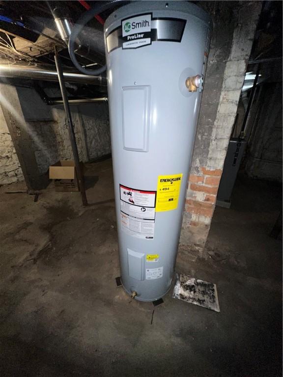 utility room with electric water heater