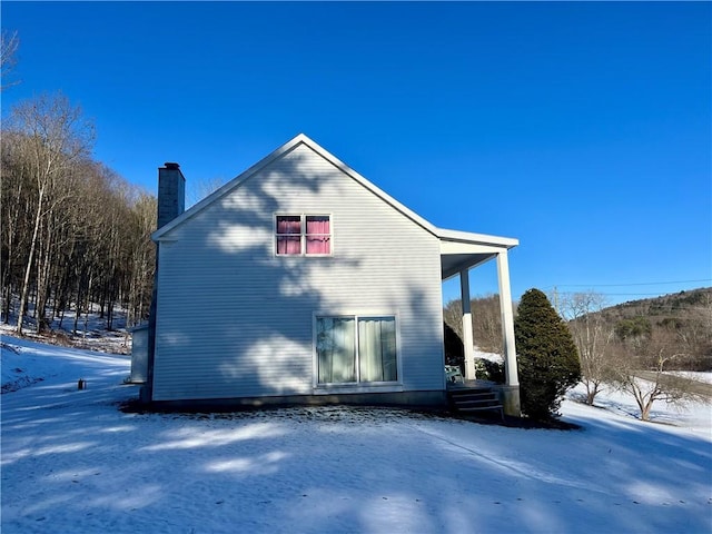 view of snow covered property