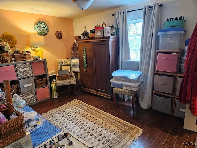 sitting room with dark hardwood / wood-style floors