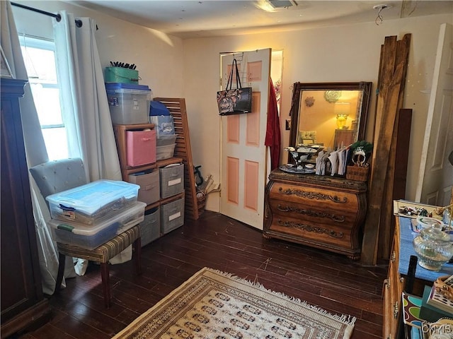 sitting room with dark hardwood / wood-style flooring