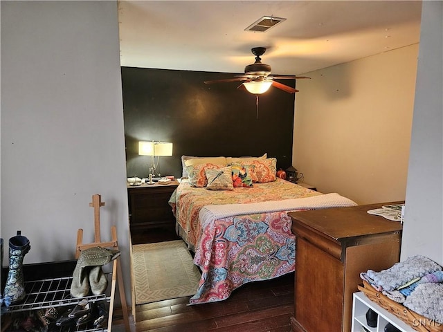 bedroom with ceiling fan and wood-type flooring