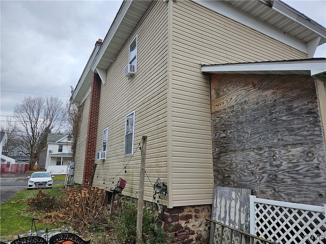 view of property exterior with cooling unit