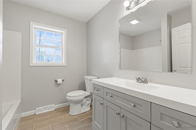 full bathroom featuring shower / washtub combination, vanity, and toilet