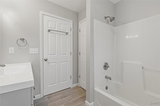 bathroom featuring vanity and bathtub / shower combination