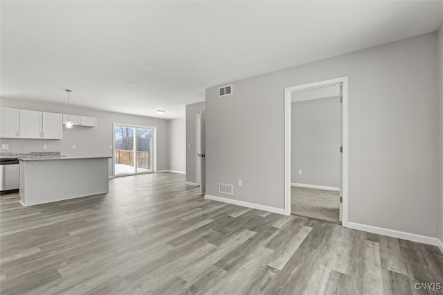 unfurnished living room with light hardwood / wood-style floors