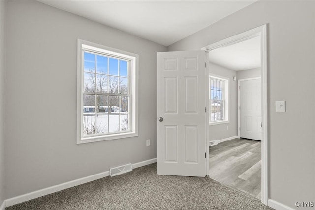 view of carpeted foyer