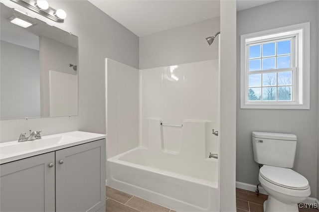 full bathroom featuring tile patterned floors, vanity, shower / bath combination, and toilet