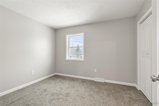 unfurnished bedroom with carpet floors and a closet