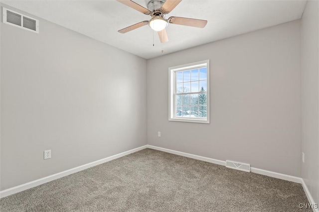 carpeted empty room with ceiling fan