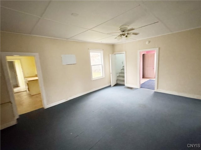 unfurnished room with ceiling fan