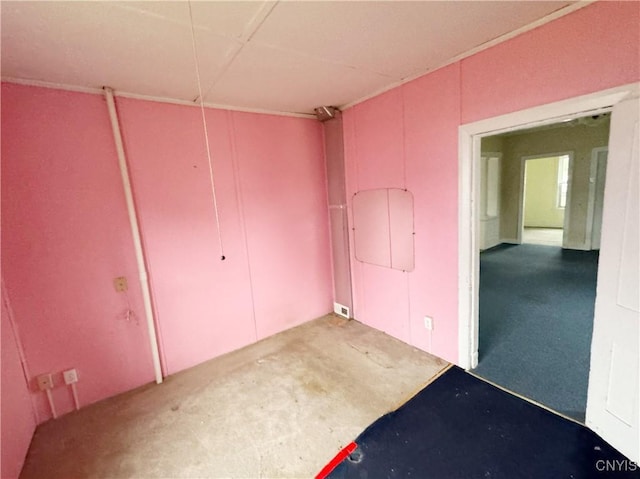 unfurnished bedroom featuring concrete flooring