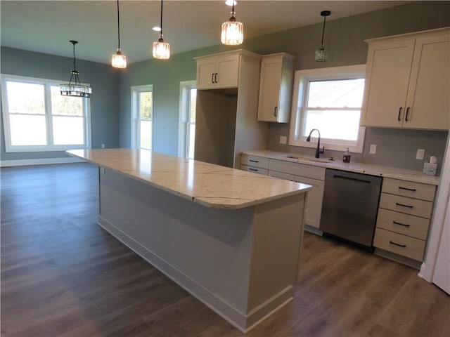 kitchen featuring white cabinetry, a center island, sink, dark wood-type flooring, and stainless steel dishwasher