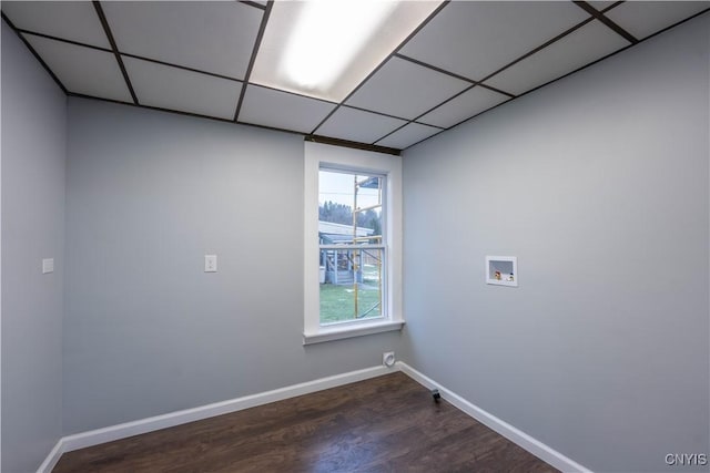 clothes washing area with hookup for a washing machine and dark hardwood / wood-style flooring