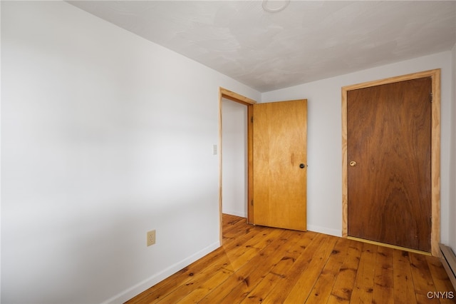 unfurnished bedroom featuring light hardwood / wood-style floors