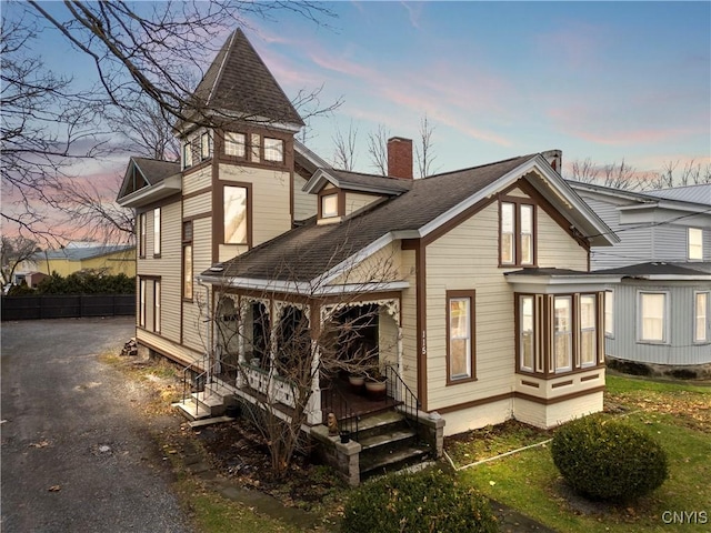 view of back house at dusk