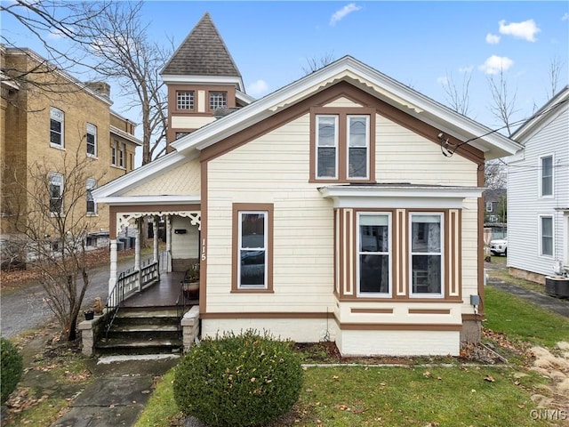 rear view of house featuring a porch