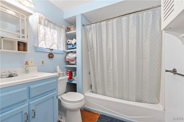 full bathroom with shower / bath combination with curtain, vanity, hardwood / wood-style flooring, and toilet