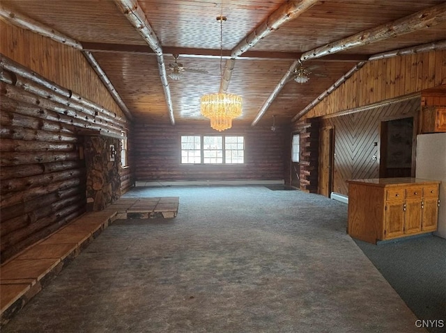 interior space featuring carpet flooring, wooden walls, and wooden ceiling