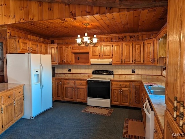 kitchen with pendant lighting, wooden ceiling, white appliances, dark colored carpet, and a notable chandelier