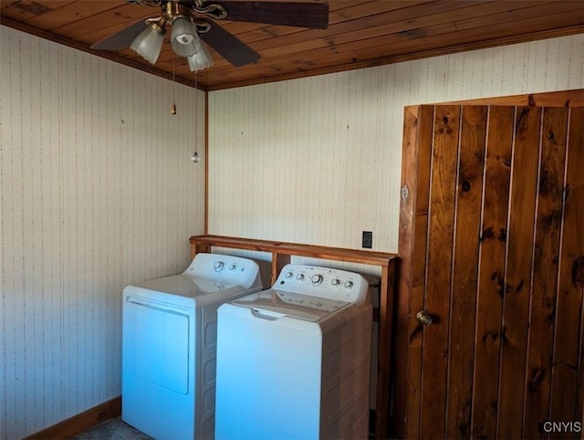 laundry area with ceiling fan, washing machine and dryer, wood ceiling, and ornamental molding