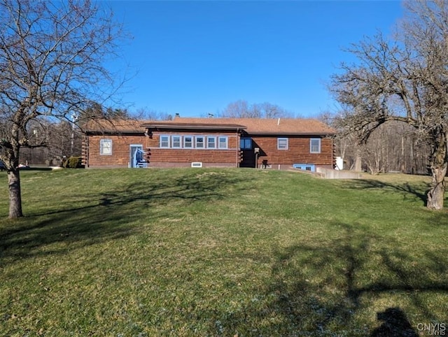 back of house with a yard