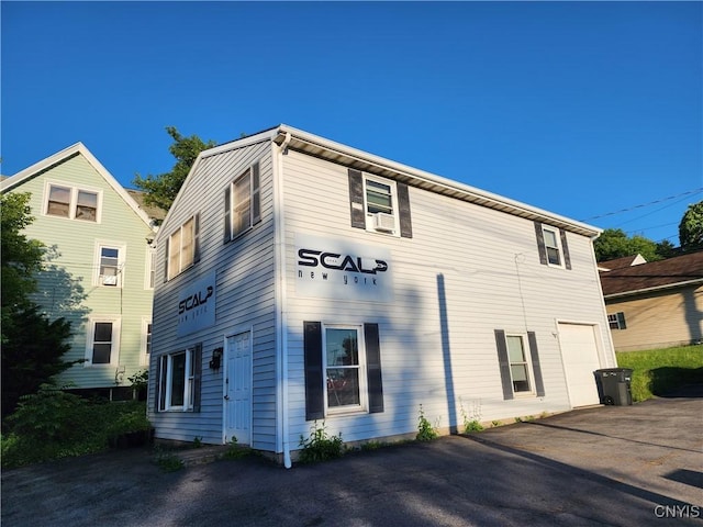 view of property exterior with a garage