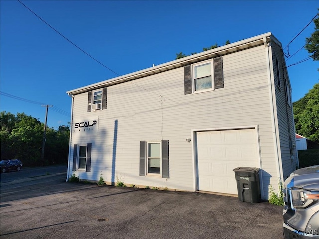 view of side of home with a garage