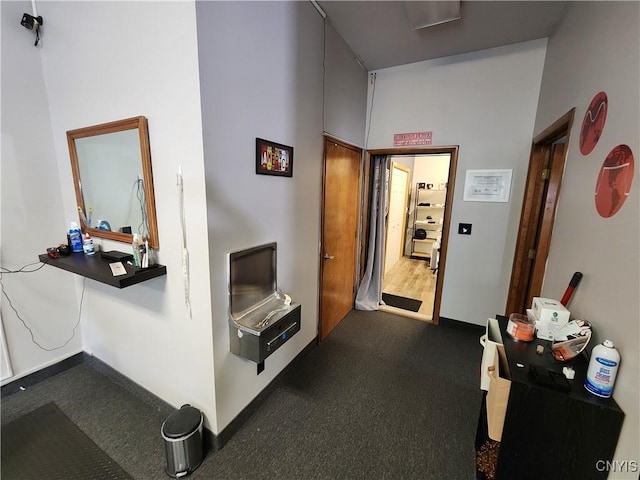 hall featuring dark wood-type flooring