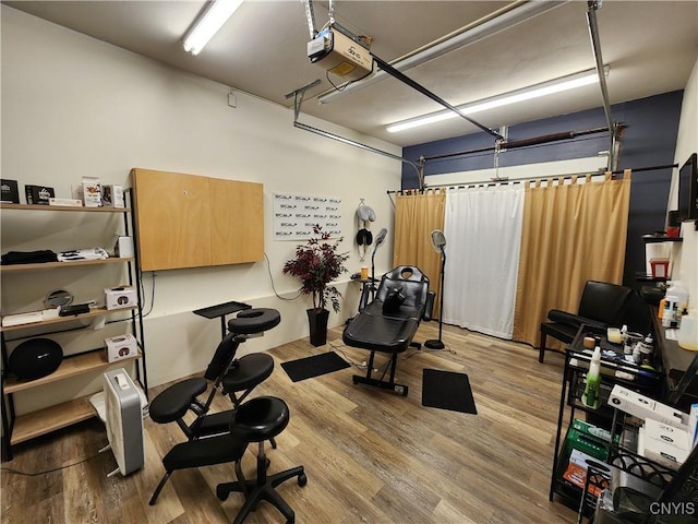 exercise area featuring light hardwood / wood-style flooring