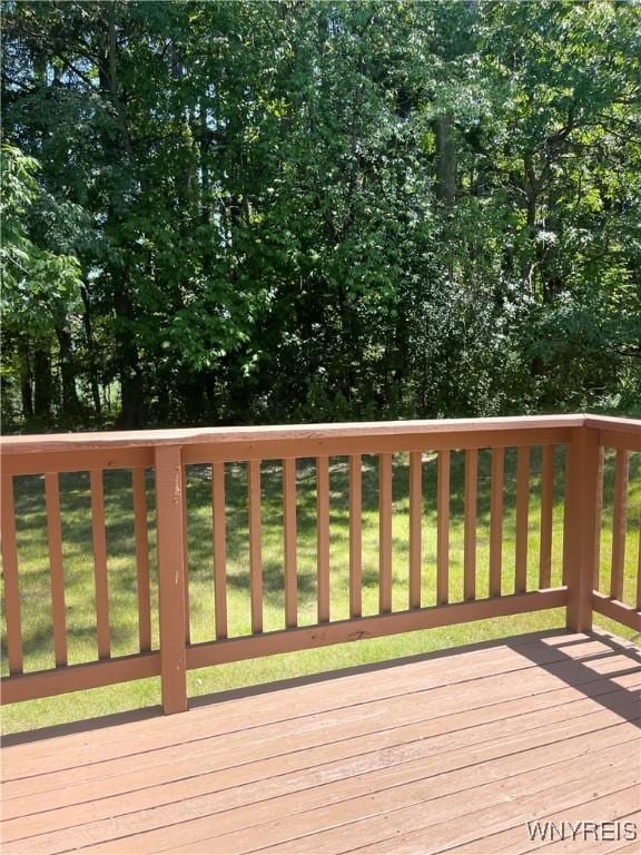 wooden terrace with a yard