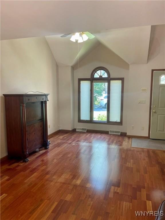 unfurnished living room featuring ceiling fan, hardwood / wood-style floors, and lofted ceiling